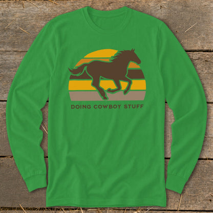 Green long-sleeve shirt with brown horse silhouette and "Doing Cowboy Stuff" text.