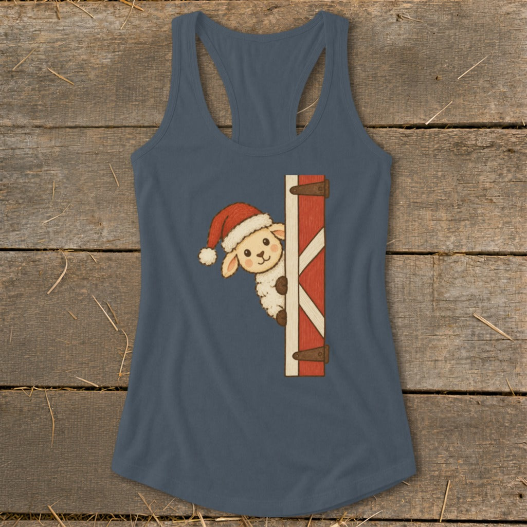 Cute sheep wearing Santa hat peeking from a barn door graphic on a dark blue tank top.