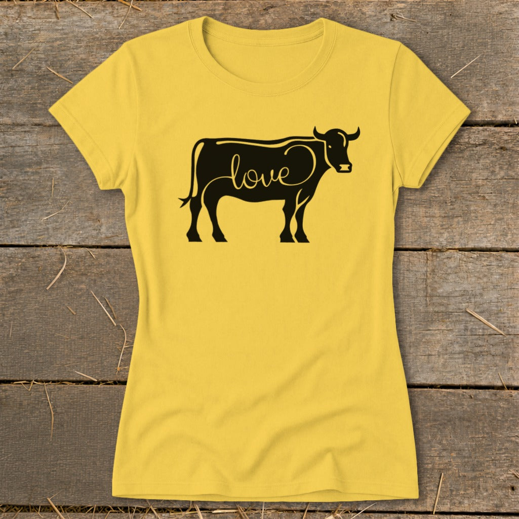 Yellow t-shirt with black cow graphic containing the word "love".