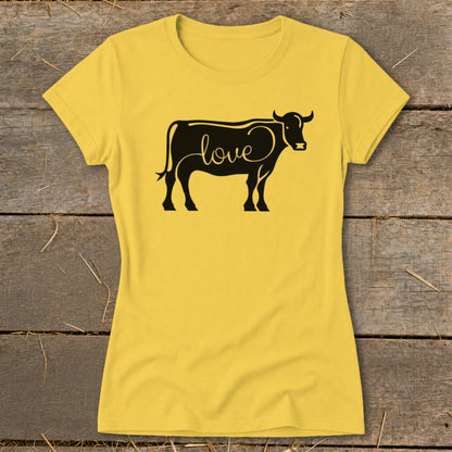 Yellow t-shirt with black cow graphic containing the word "love".