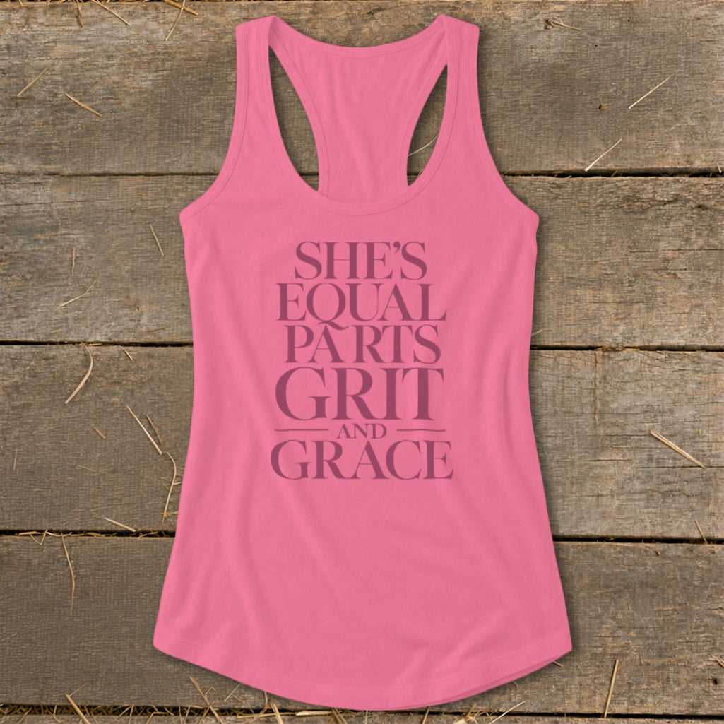 Pink tank top with text "She's equal parts grit and grace".