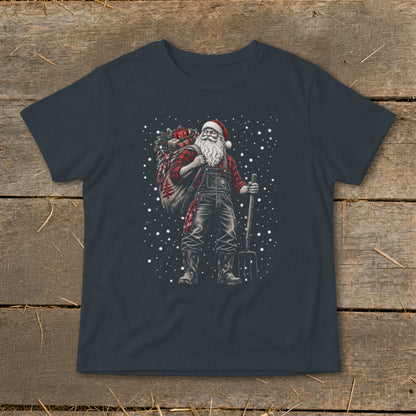 Farmer Santa carrying a sack of gifts and a pitchfork in falling snow.