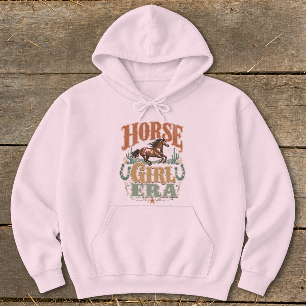 Pink hoodie with "Horse Girl Era" text and running horse graphic.