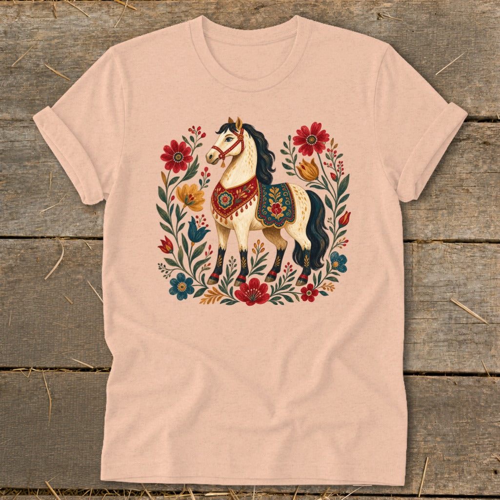 Peach t-shirt with a cream horse and floral design.