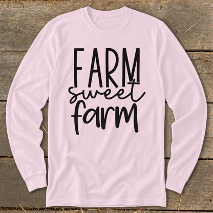 Pink long sleeve shirt with "FARM sweet farm" text in black.