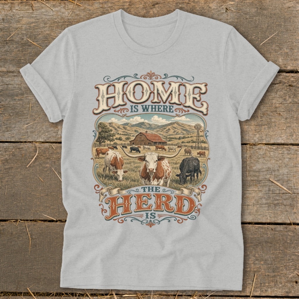 T-shirt graphic says "HOME IS WHERE THE HERD IS" with cattle and farm scene.