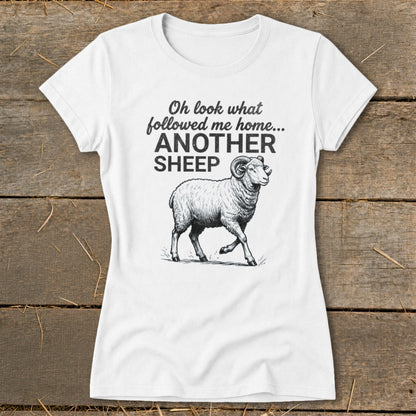White t-shirt with text "Oh look what followed me home... ANOTHER SHEEP" and a ram illustration.