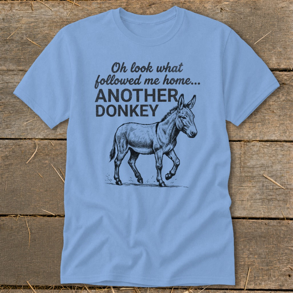 Light blue t-shirt with sketch of donkey and text "Oh look what followed me home... ANOTHER DONKEY".