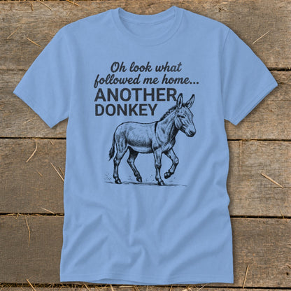 Light blue t-shirt with sketch of donkey and text "Oh look what followed me home... ANOTHER DONKEY".