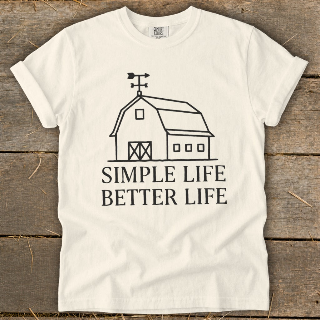 White t-shirt with black barn graphic and text "SIMPLE LIFE BETTER LIFE".
