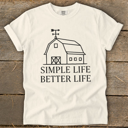 White t-shirt with black barn graphic and text "SIMPLE LIFE BETTER LIFE".