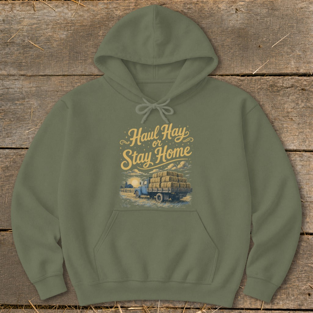 Olive green hoodie with "Haul Hay or Stay Home" text and truck full of hay graphic.