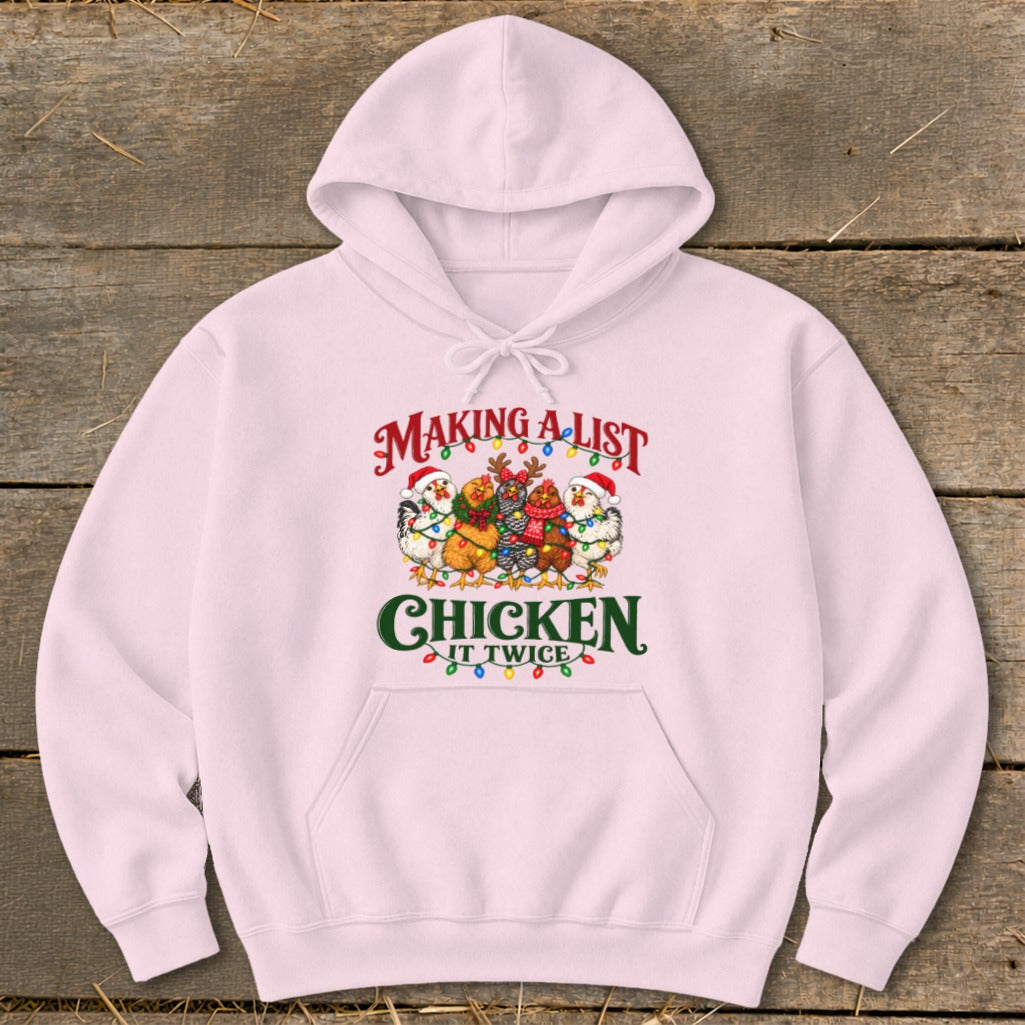 Pink hoodie with graphic text "Making a list Chicken it twice" and chickens.