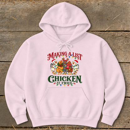 Pink hoodie with graphic text "Making a list Chicken it twice" and chickens.
