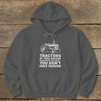 Dark gray hoodie with white tractor graphic and text.