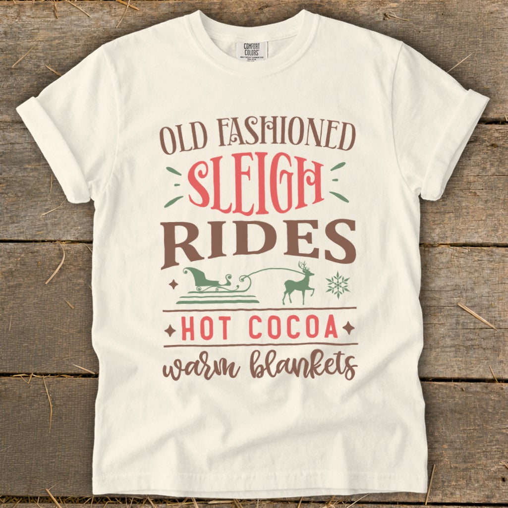 White t-shirt with text "Old Fashioned Sleigh Rides Hot Cocoa Warm Blankets".