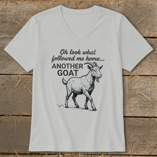 Light grey v-neck t-shirt with a goat illustration and text "Oh look what followed me home... ANOTHER GOAT".