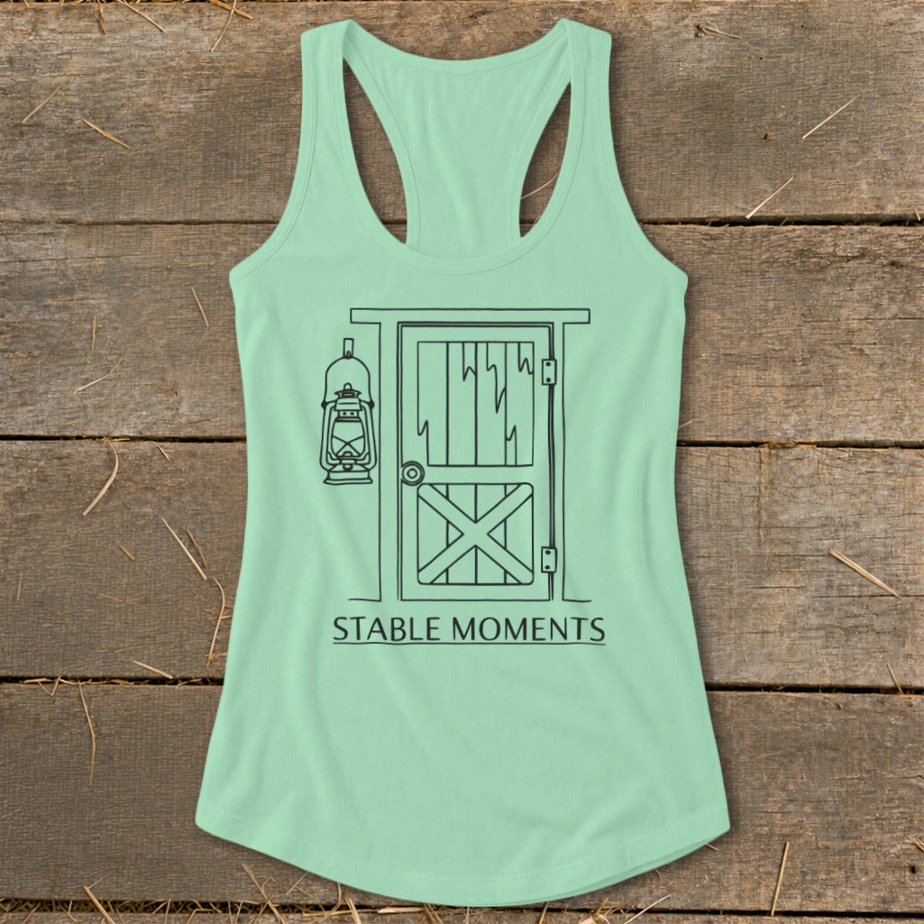 Light green tank top with barn door and lantern graphic and "STABLE MOMENTS" text.
