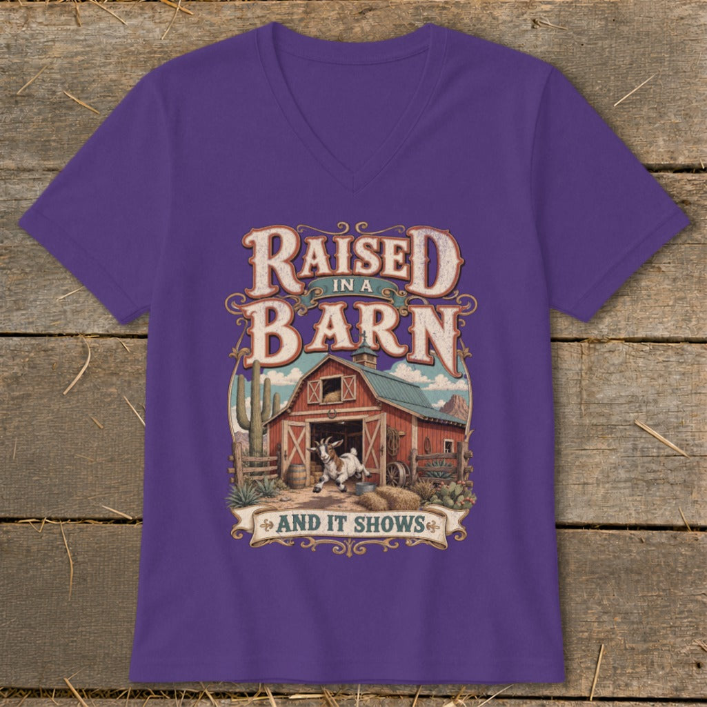 Purple t-shirt with "Raised in a Barn and it Shows" text and barn graphic.