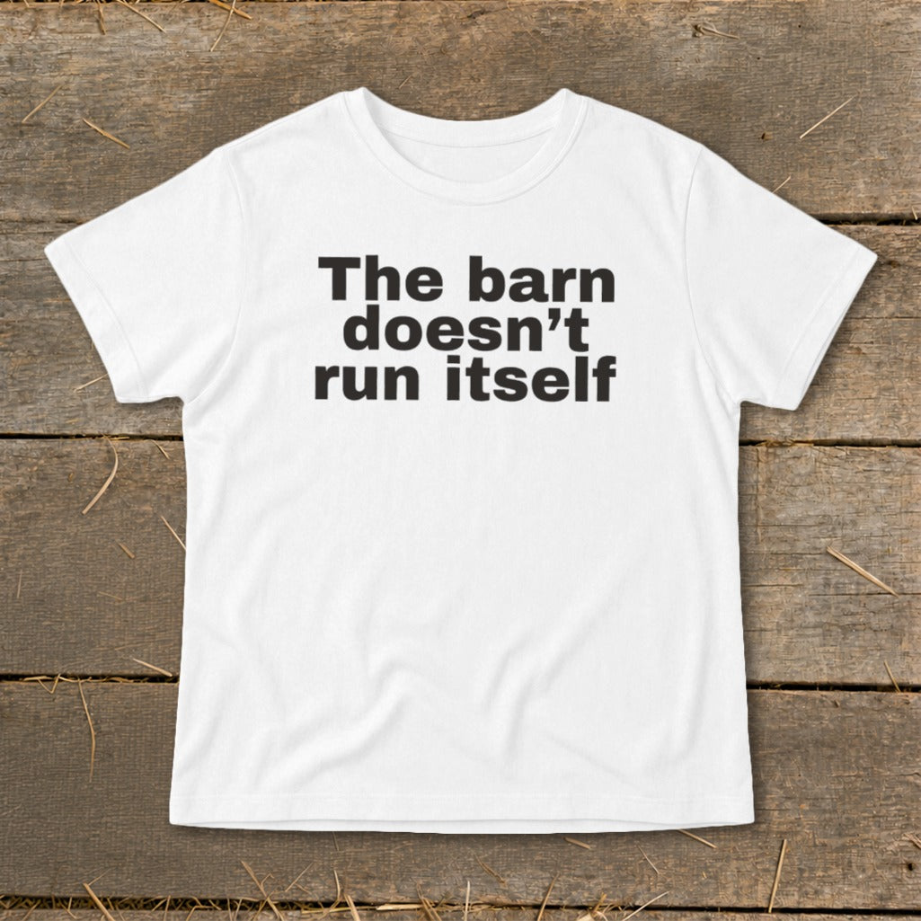 White t-shirt with black text that reads "The barn doesn't run itself".