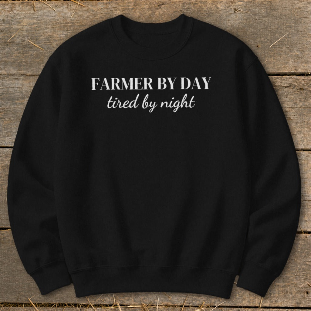 Black sweatshirt with "FARMER BY DAY tired by night" white text.