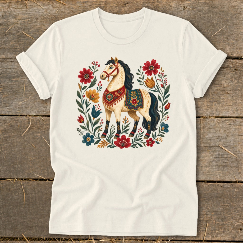Cream t-shirt with a stylized horse surrounded by colorful flowers and folk art patterns.