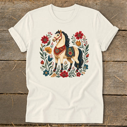 Cream t-shirt with a stylized horse surrounded by colorful flowers and folk art patterns.