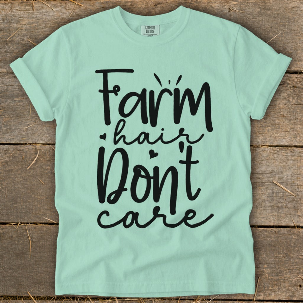 Light mint green t-shirt with black text "Farm hair Don't care".