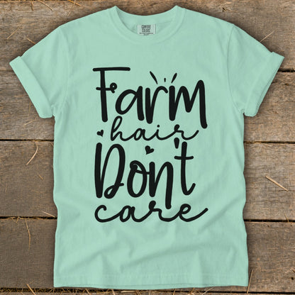 Light mint green t-shirt with black text "Farm hair Don't care".