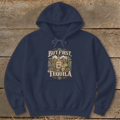 Navy hoodie with "But First, Tequila" graphic featuring tequila bottle, shot, and desert scene.