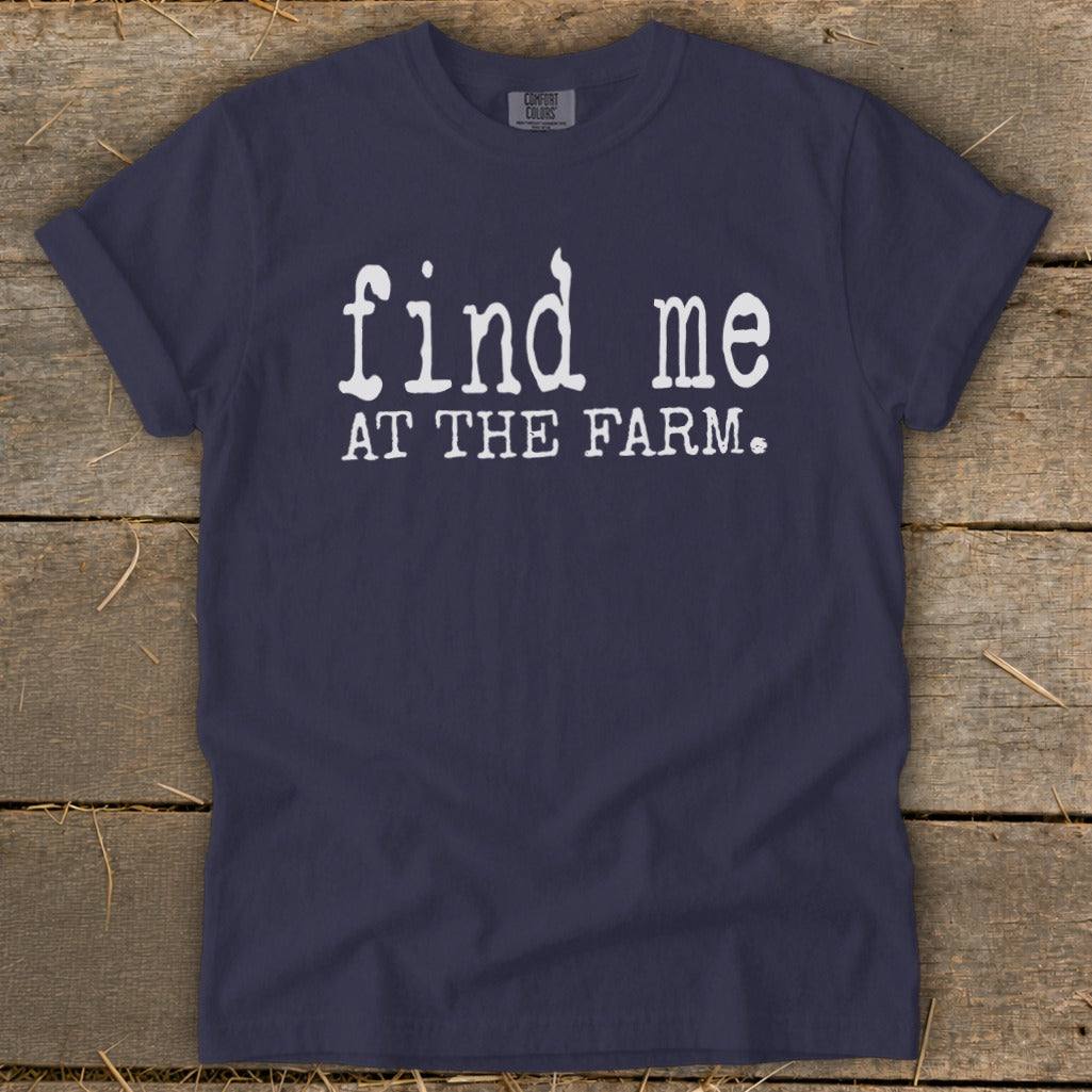 Navy t-shirt with white text "find me AT THE FARM."