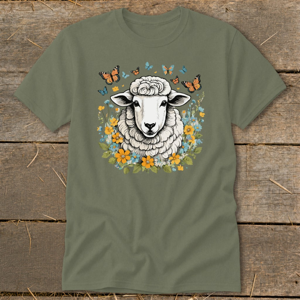 Green t-shirt with illustration of sheep surrounded by flowers and butterflies.
