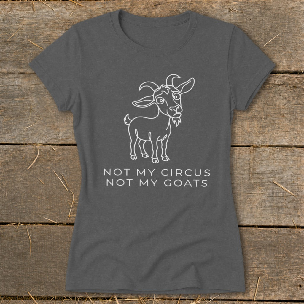 Dark gray t-shirt with a white line drawing of a goat and text "NOT MY CIRCUS NOT MY GOATS".