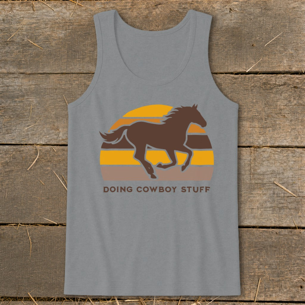 Grey tank top with brown horse and sunset graphic and "DOING COWBOY STUFF" text.