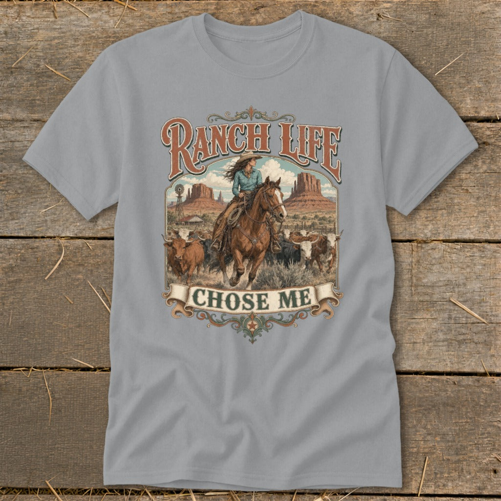 Gray t-shirt featuring a cowboy riding a horse with cattle, reading "Ranch Life Chose Me."