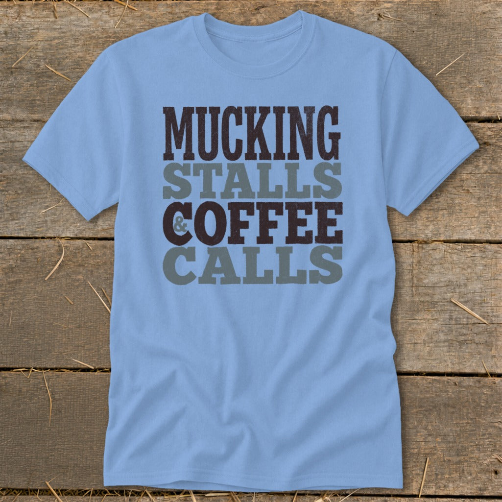 Light blue t-shirt with text: "Mucking Stalls & Coffee Calls".