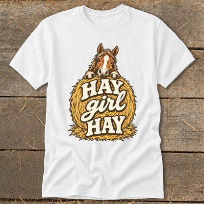 White t-shirt with a horse peeking over a bale of hay, text reads "HAY girl HAY".