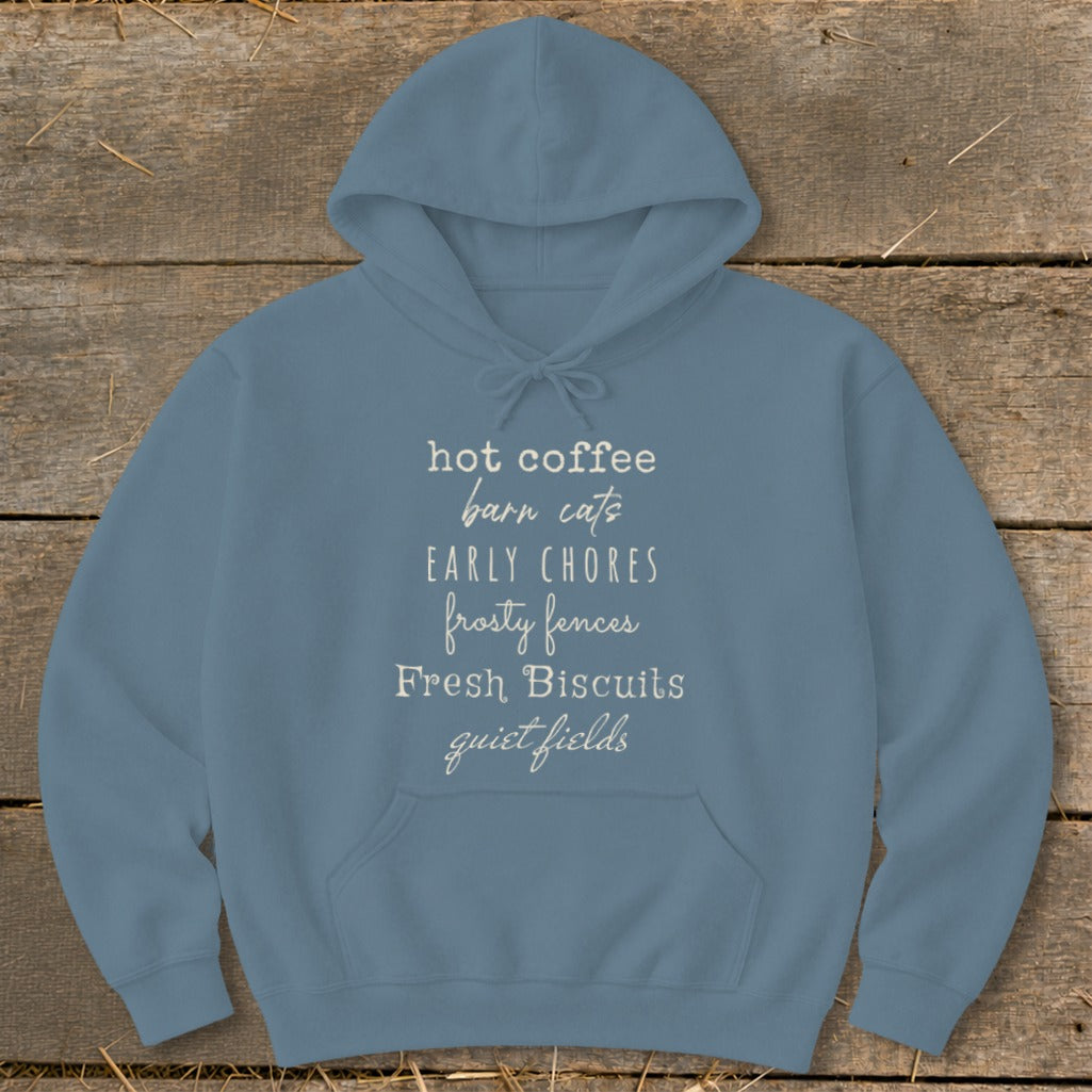 Blue hoodie with text: hot coffee, barn cats, early chores, frosty fences, fresh biscuits, quiet fields.