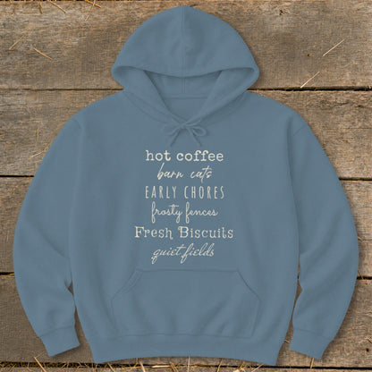 Blue hoodie with text: hot coffee, barn cats, early chores, frosty fences, fresh biscuits, quiet fields.