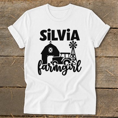 White t-shirt with black "SILVIA farmgirl" text and farm imagery.