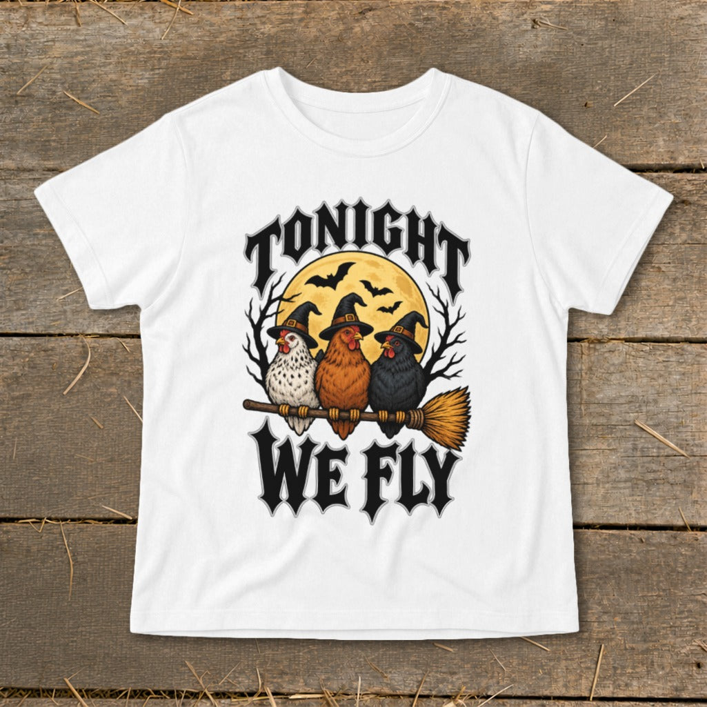 Three chickens wear witch hats and ride a broomstick under a full moon with text "TONIGHT WE FLY".