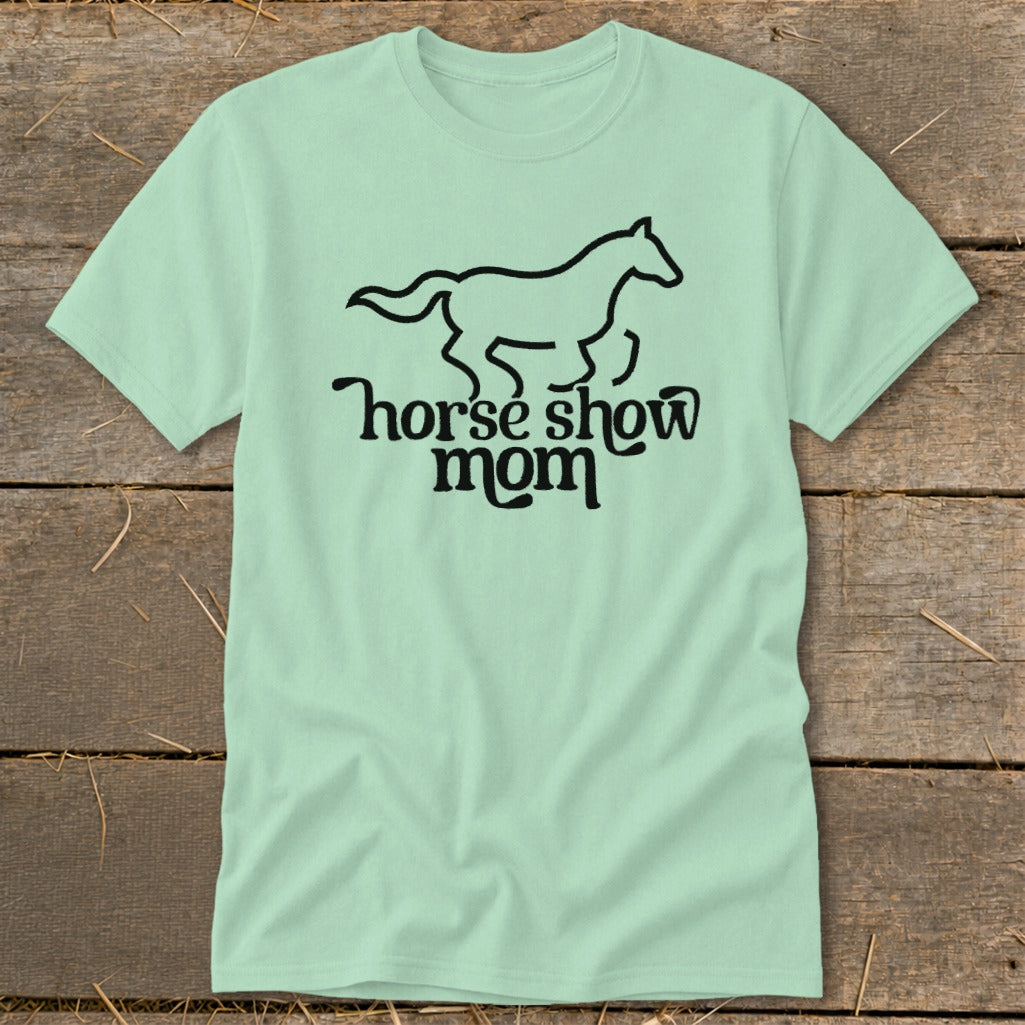 Light mint t-shirt with a black outline of a galloping horse and the text "horse show mom".