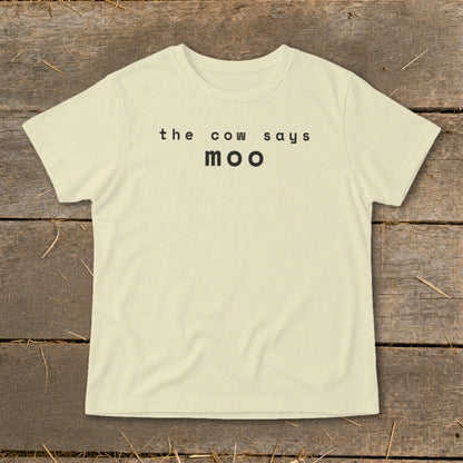 Light yellow t-shirt with black text that reads "the cow says moo".
