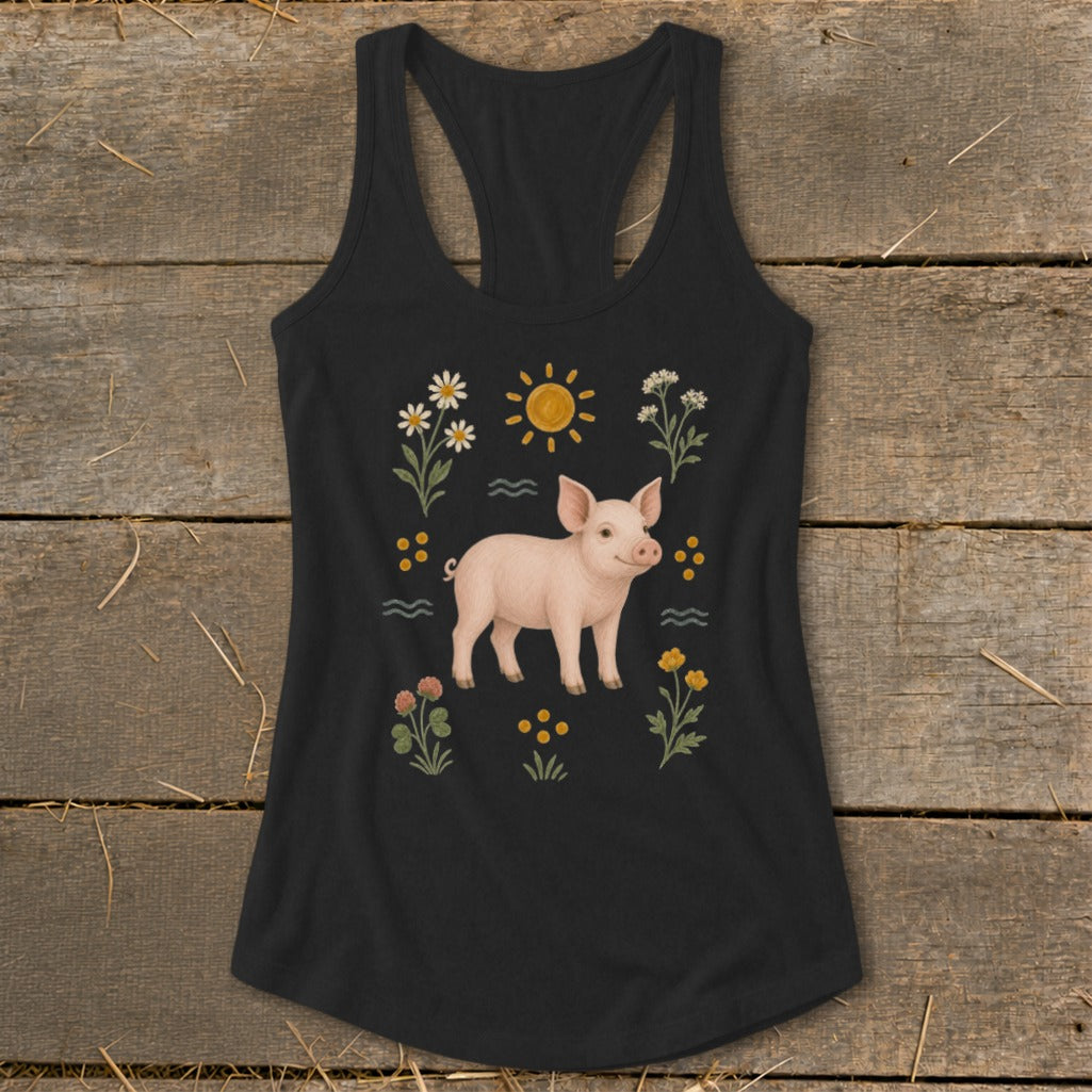Black tank top with a pink pig illustration surrounded by flowers and a sun.