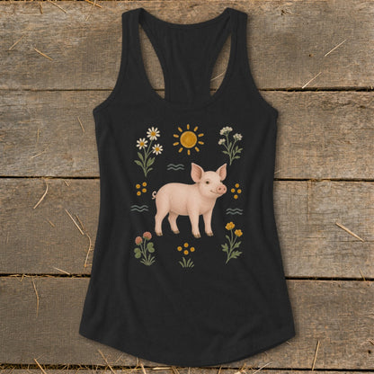 Black tank top with a pink pig illustration surrounded by flowers and a sun.