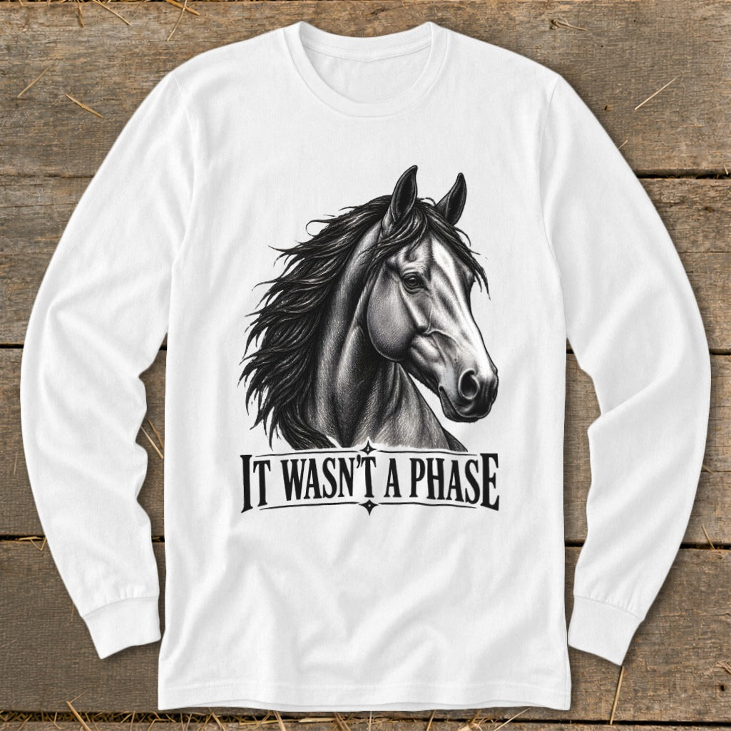 White long-sleeve shirt with a black and white horse graphic and text "IT WASN'T A PHASE".