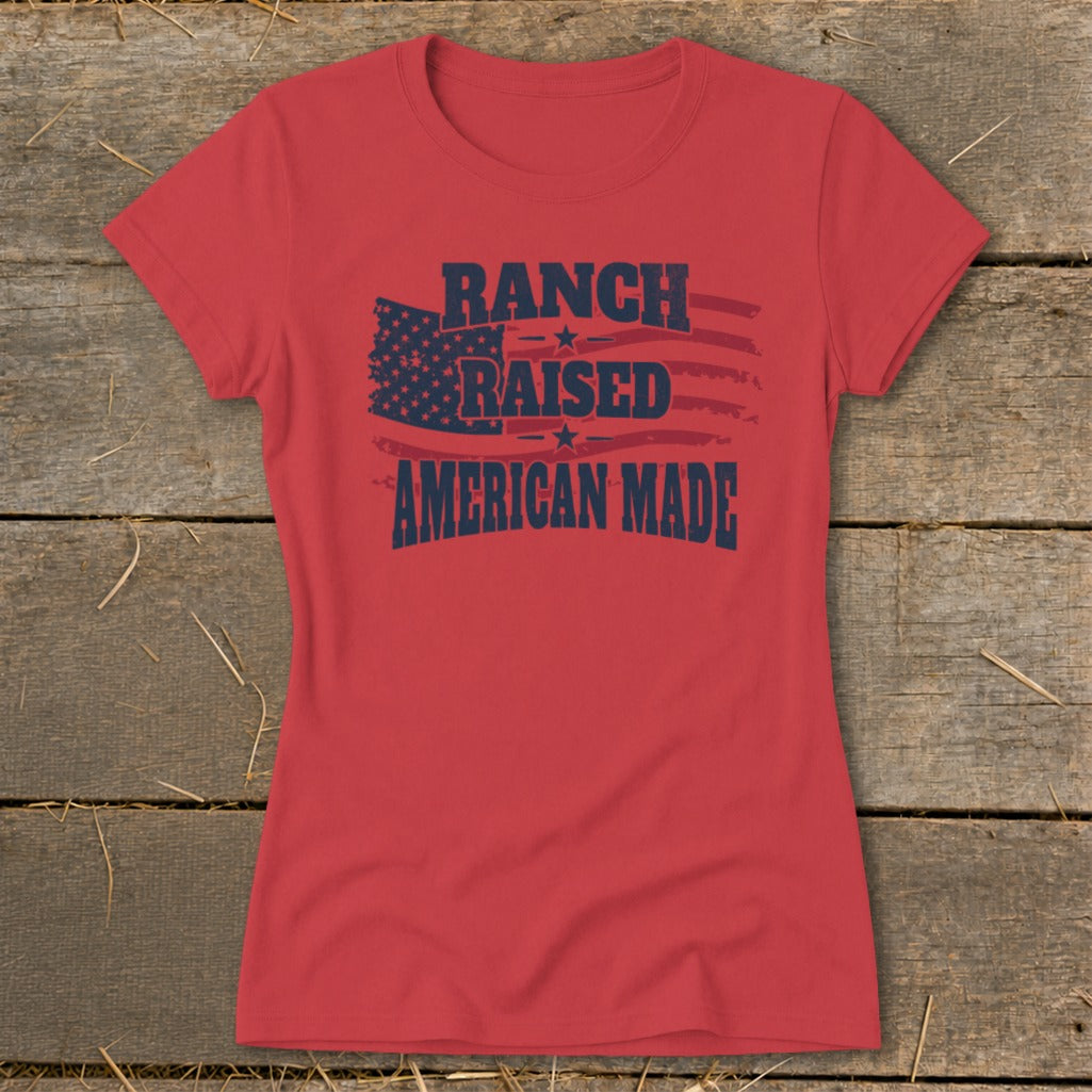 Red t-shirt with text "RANCH RAISED AMERICAN MADE" and American flag graphic.