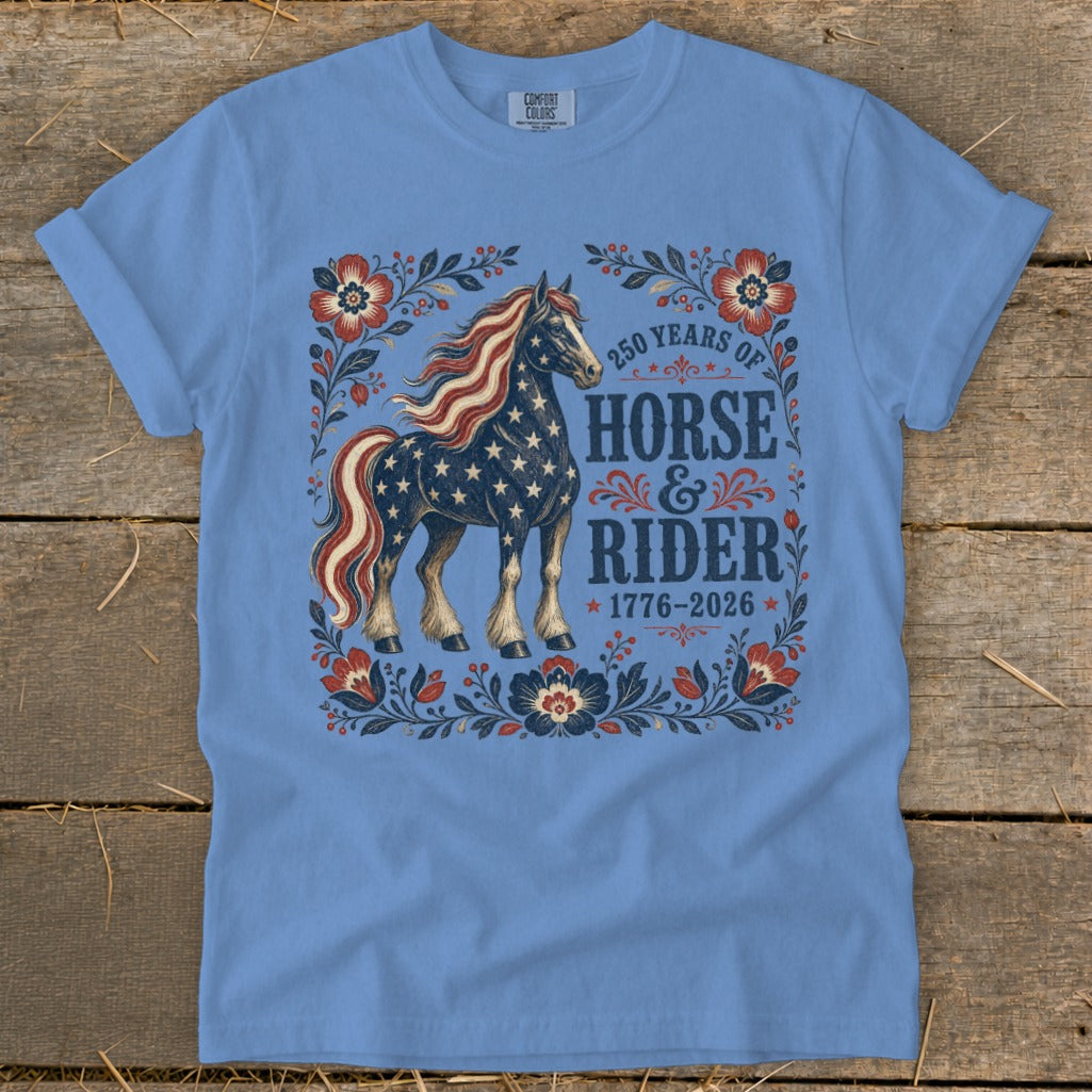 Blue t-shirt with American flag horse design and text "250 Years of Horse & Rider 1776-2026".