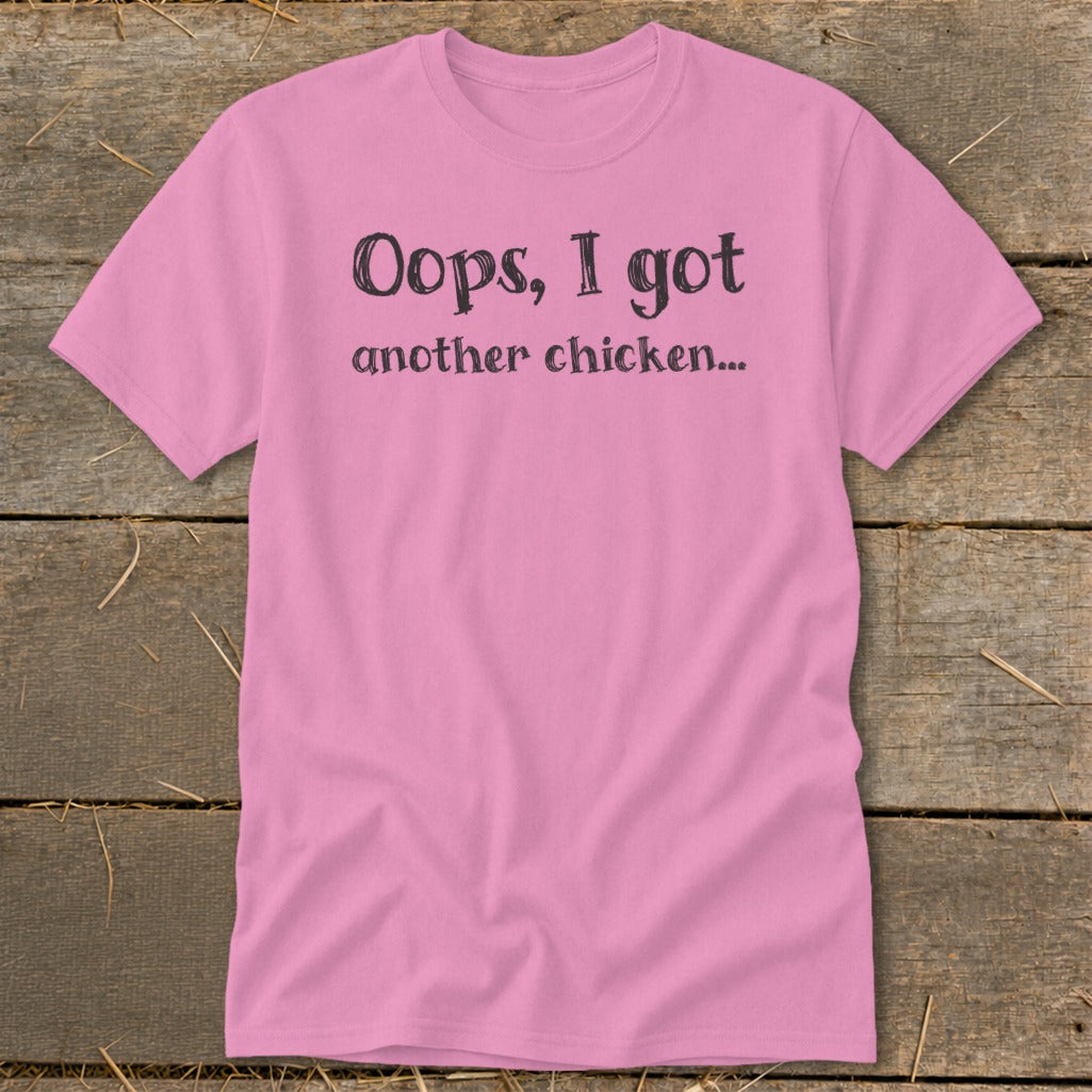 Pink t-shirt with black text that reads "Oops, I got another chicken..."