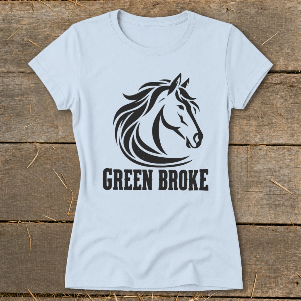 A light blue t-shirt with a black graphic of a horse head and the text GREEN BROKE.